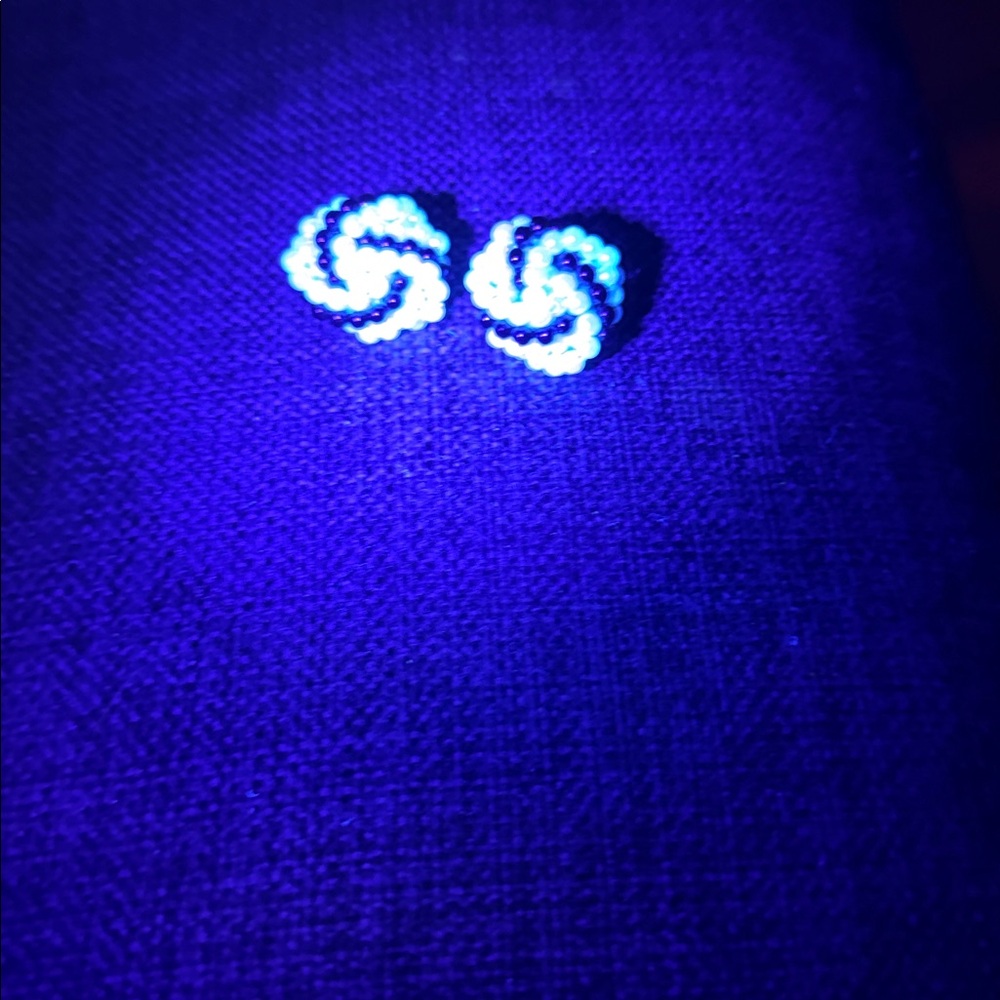 Vintage glow under UV light clamp on white and black earrings